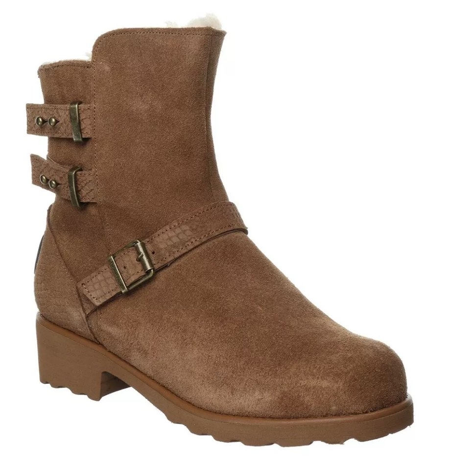 A brown strappy heeled suede winter boot