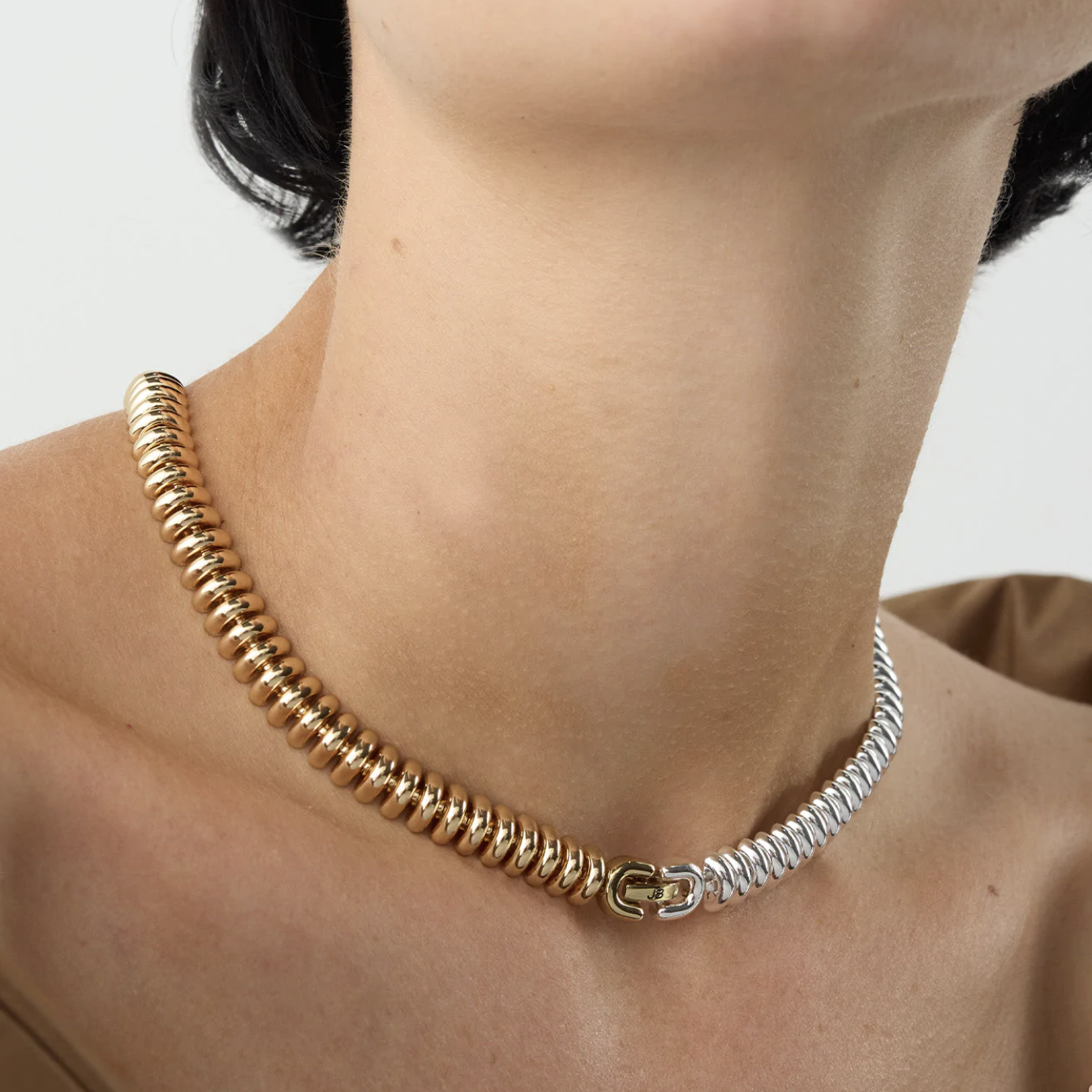 a close up of the two-tone choker on a person&#x27;s neck