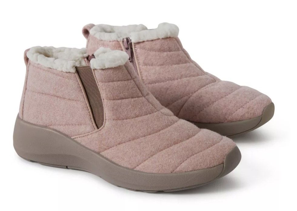 A pair of pink, fur lined ankle booties