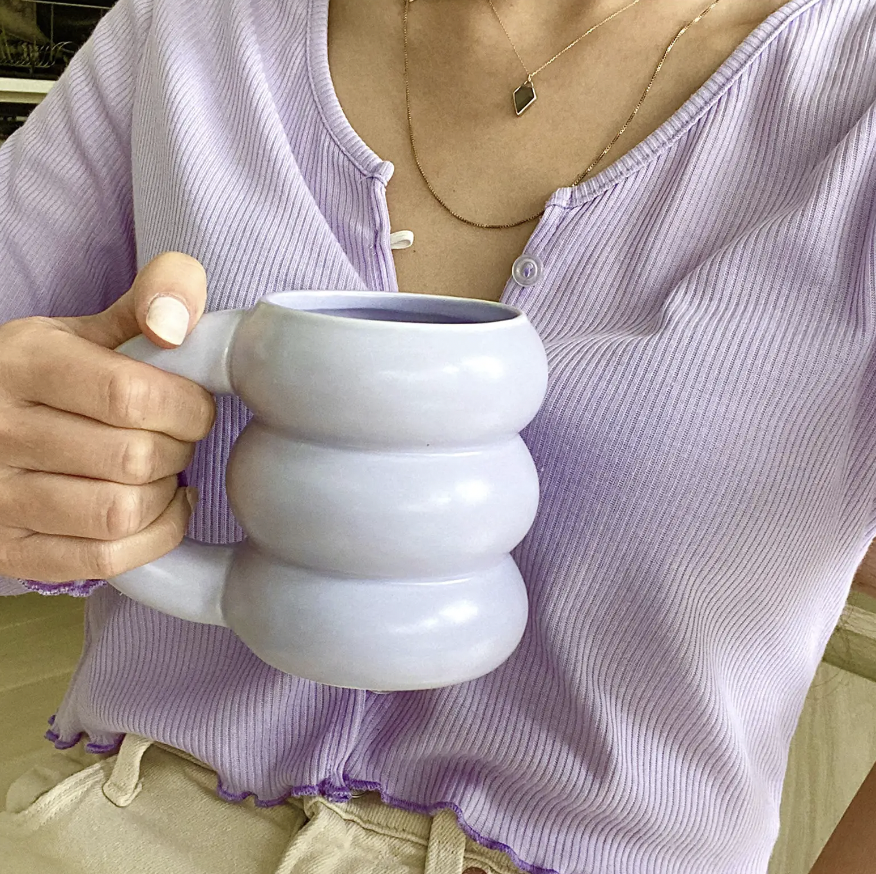 a person holding the oversized bubble mug