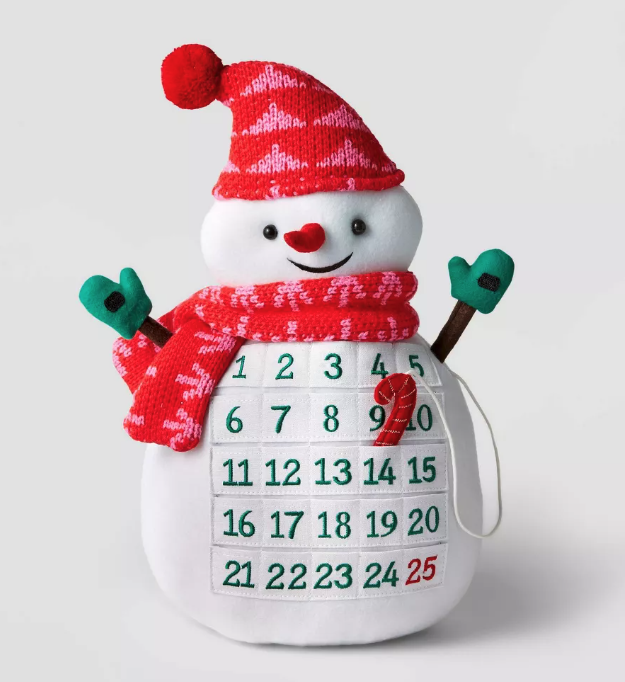 a plush snowman advent calendar with a candy cane to move from each pocket with a number on it