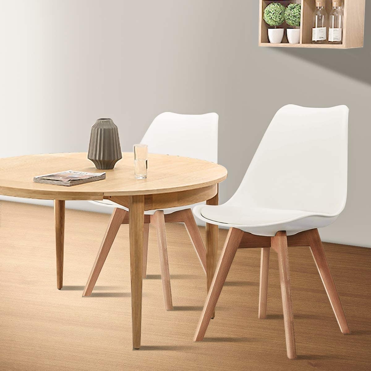 the two chairs by a small dining table