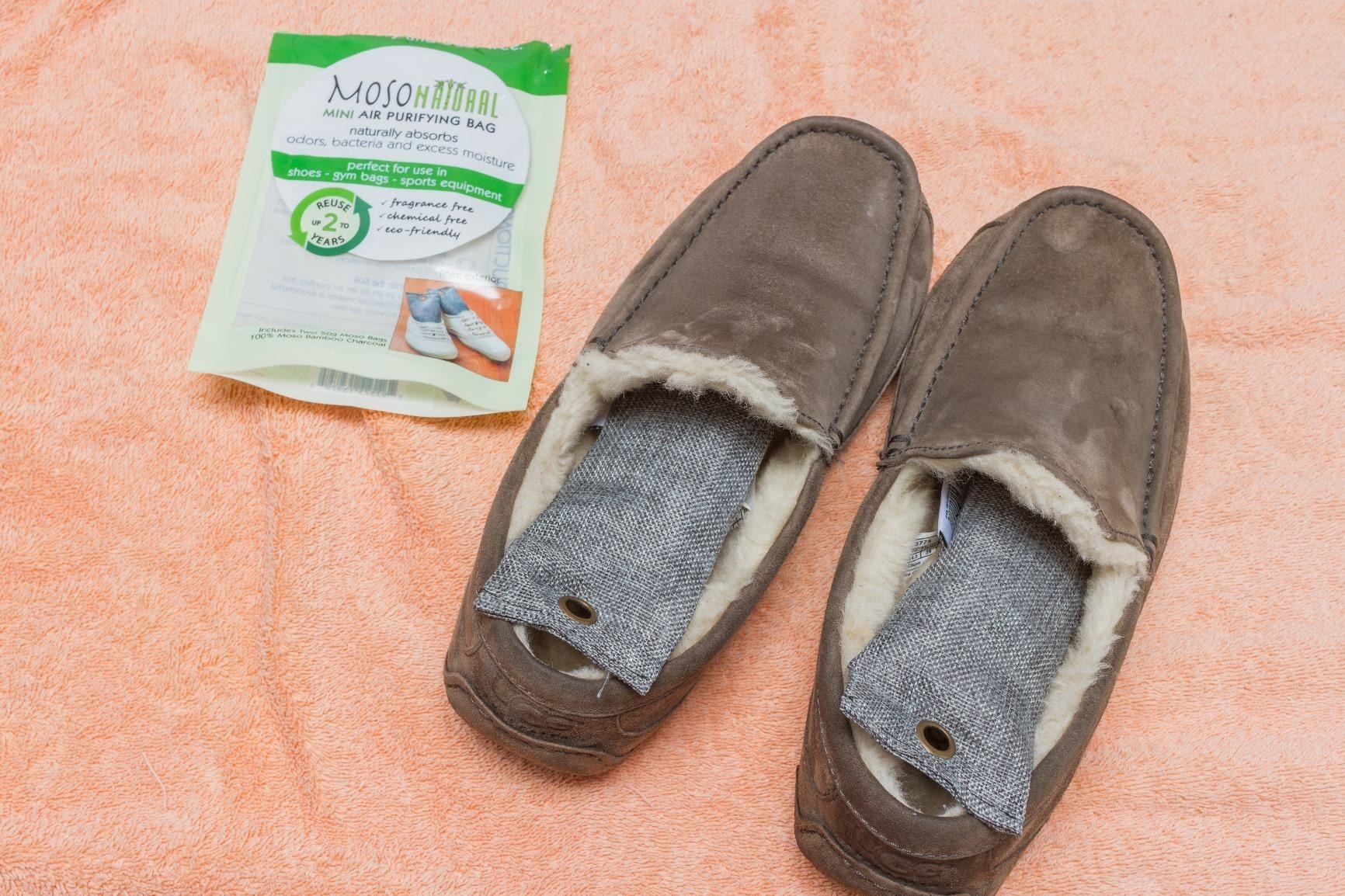 reviewer image of a pair of loafers with a deodorizer in each shoe