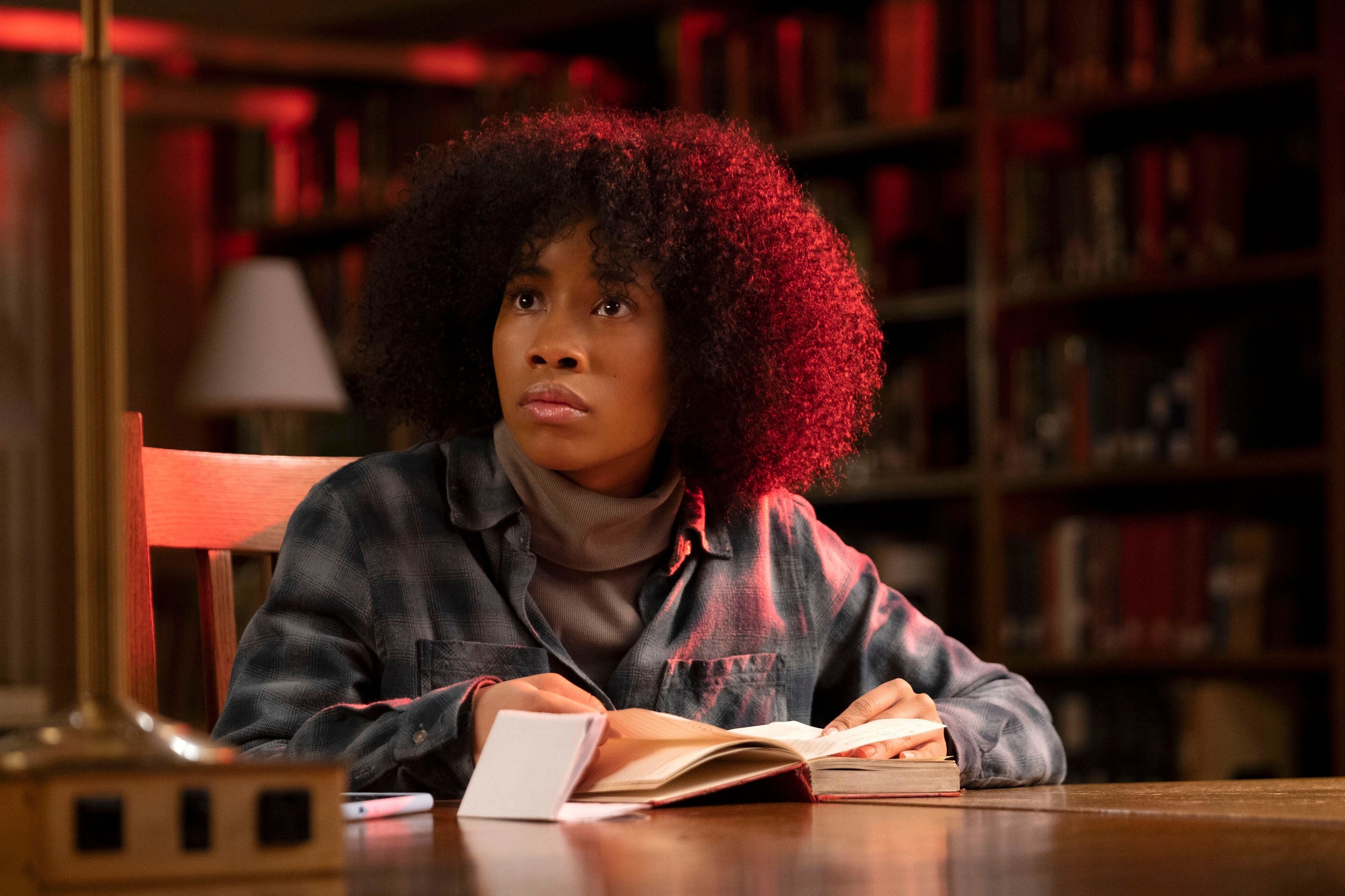 A young African American woman learns something disconcerting at her school’s library in “Master”