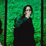 Katniss from Hunger Games giving the Three-Finger Salute