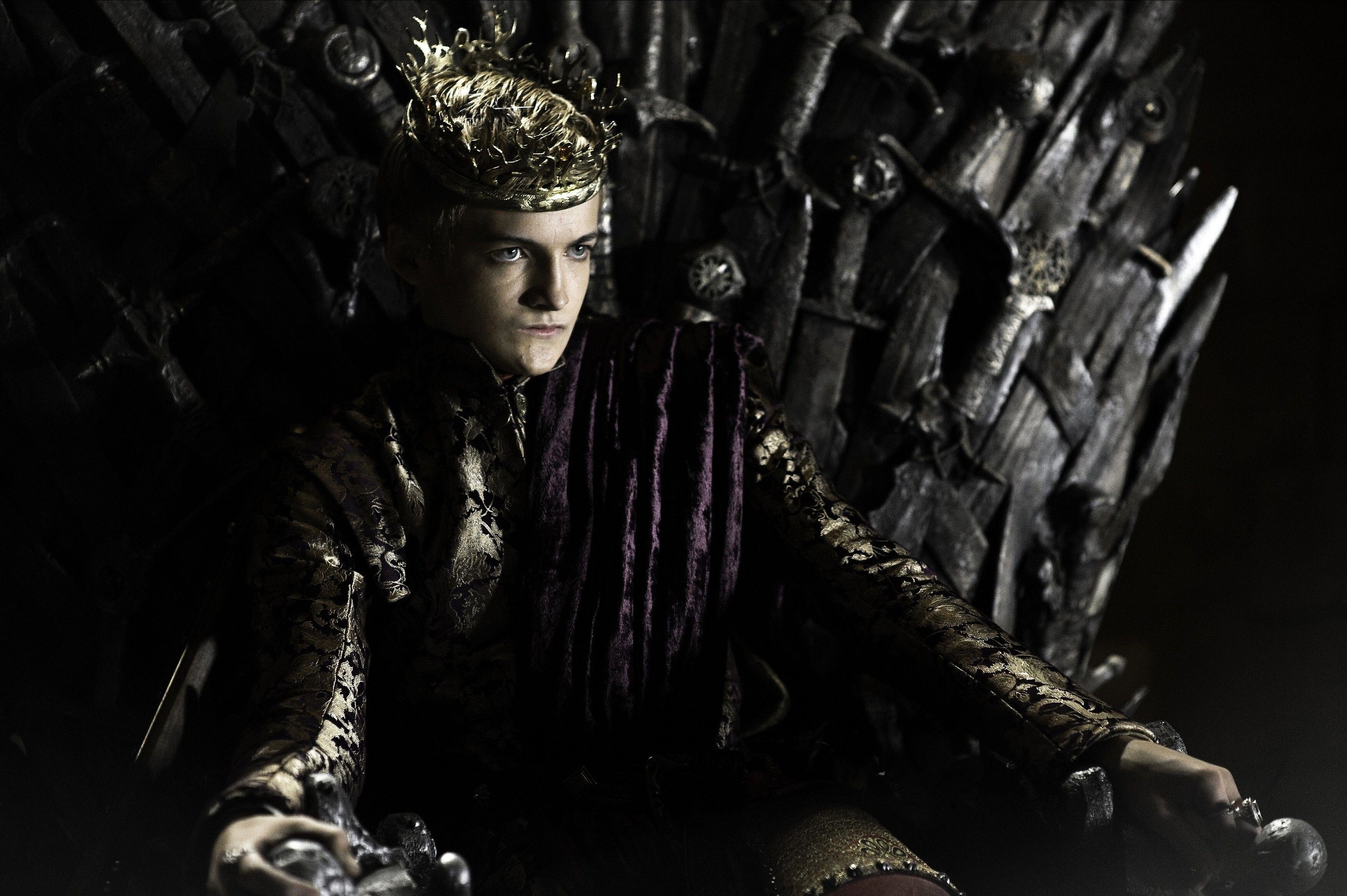 A petulant child king sits in anger on the Iron Throne