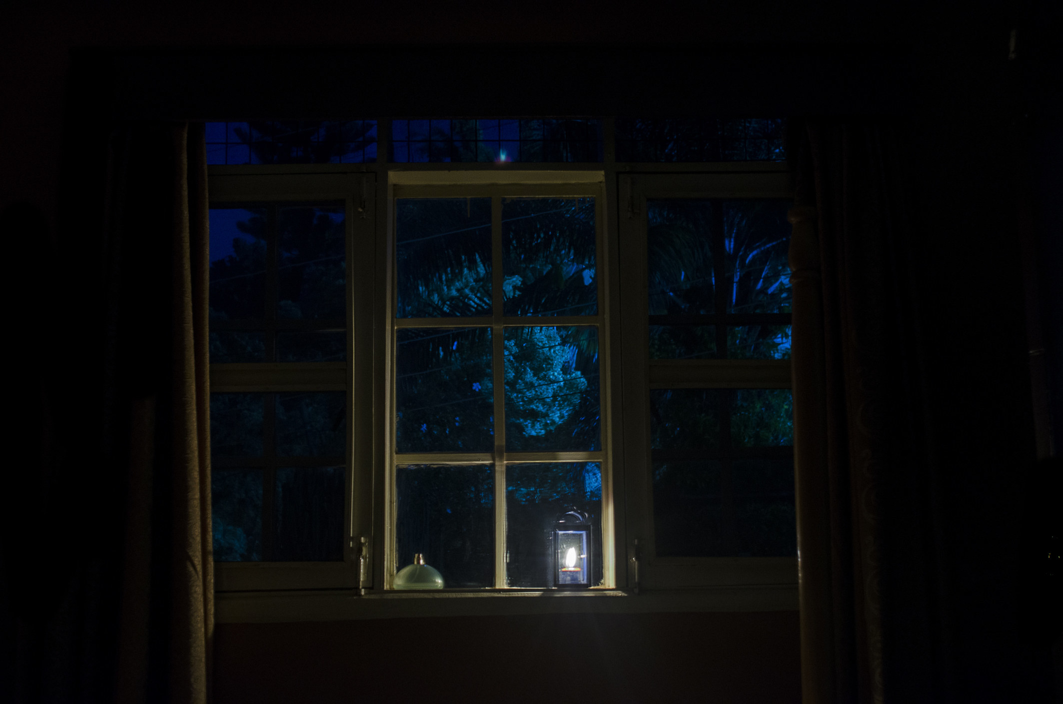 A window with a lantern on the sill