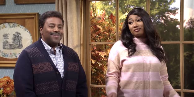 Kenan Thompson and Megan during a skit with fall foliage behind them