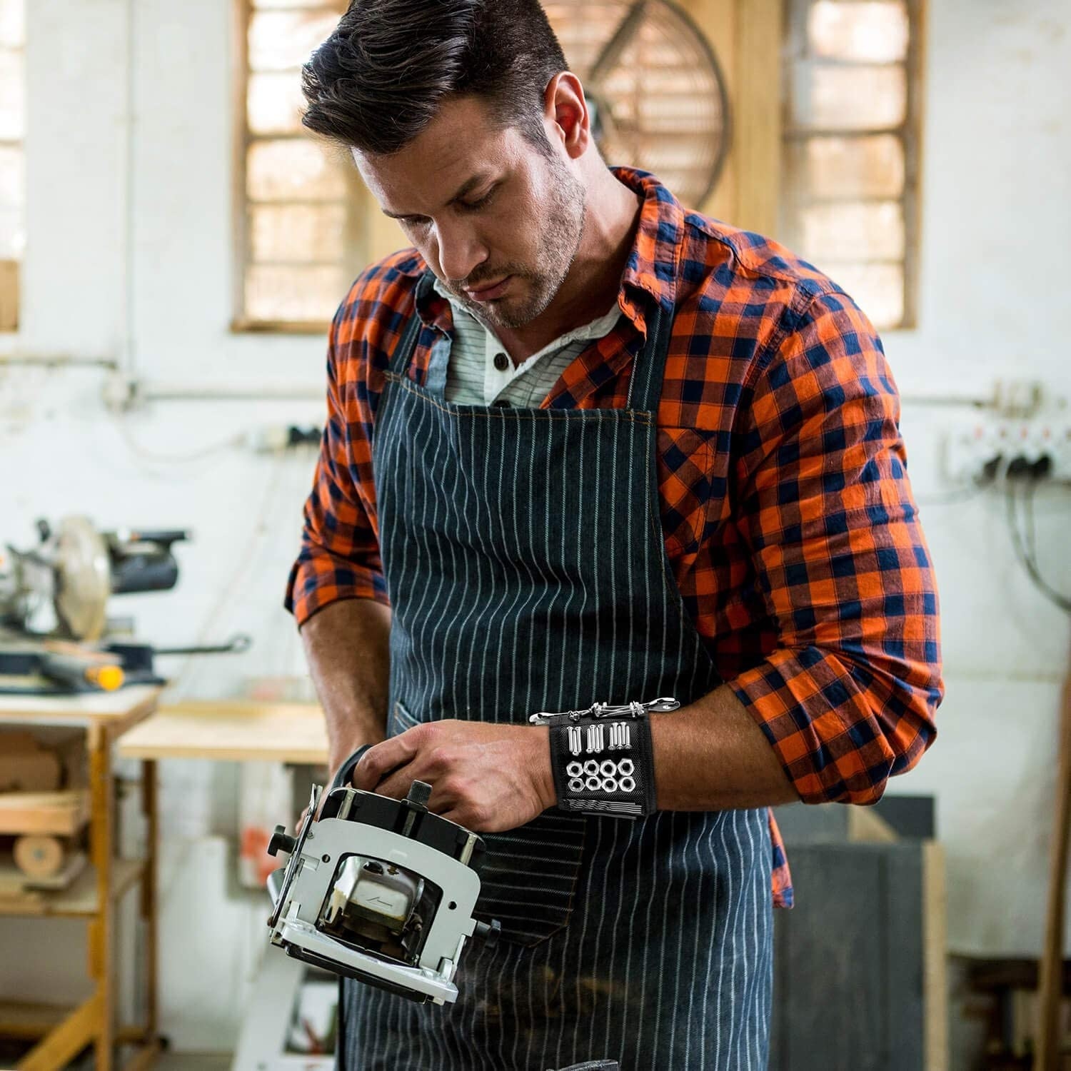 a person wearing the magnetic wristband while working with power tools