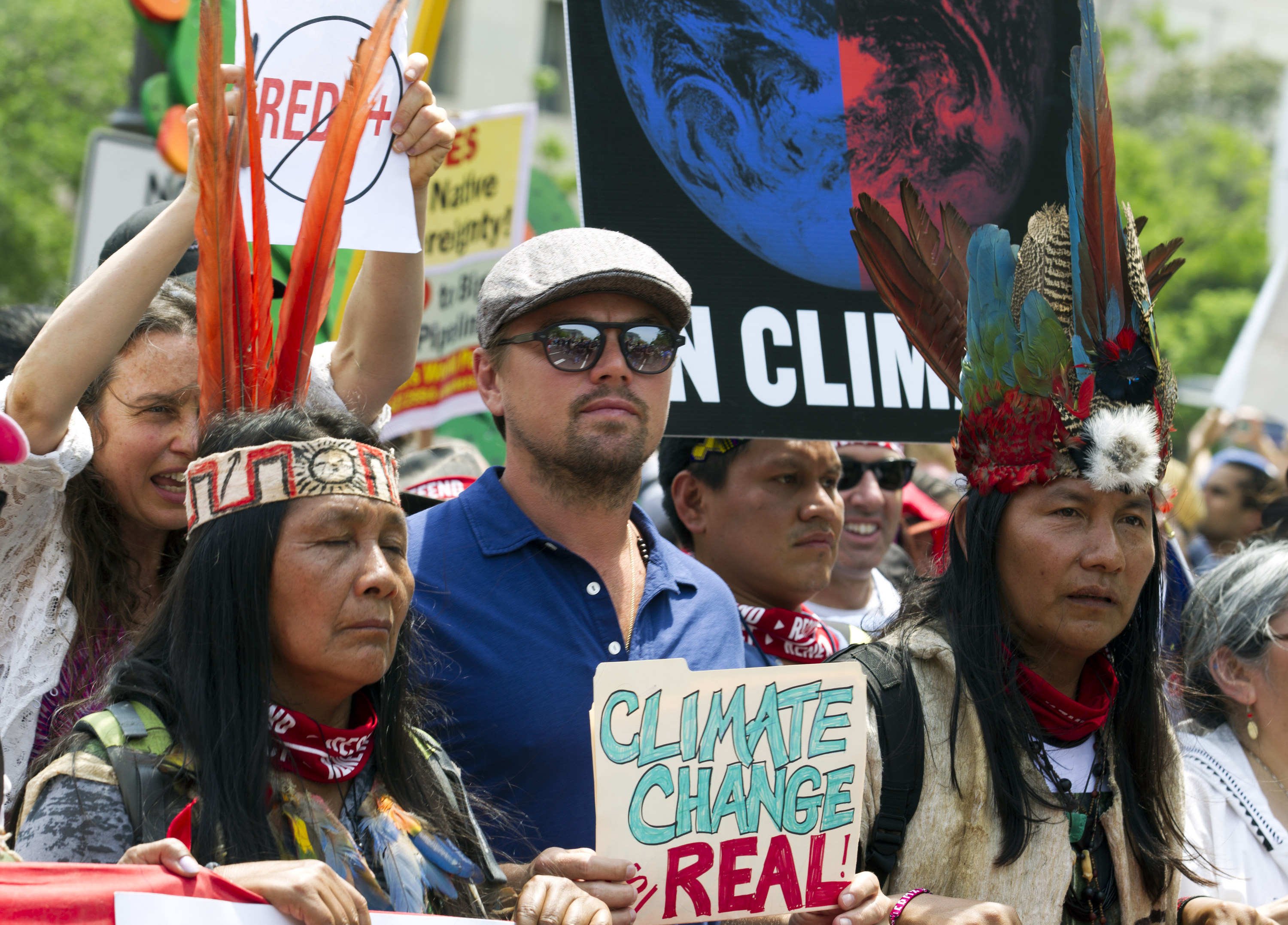 US actor Leonardo DiCaprio marches with a group of indigenous people from North and South America, during the People&#x27;s Climate March in Washington DC, on April, 29, 2017