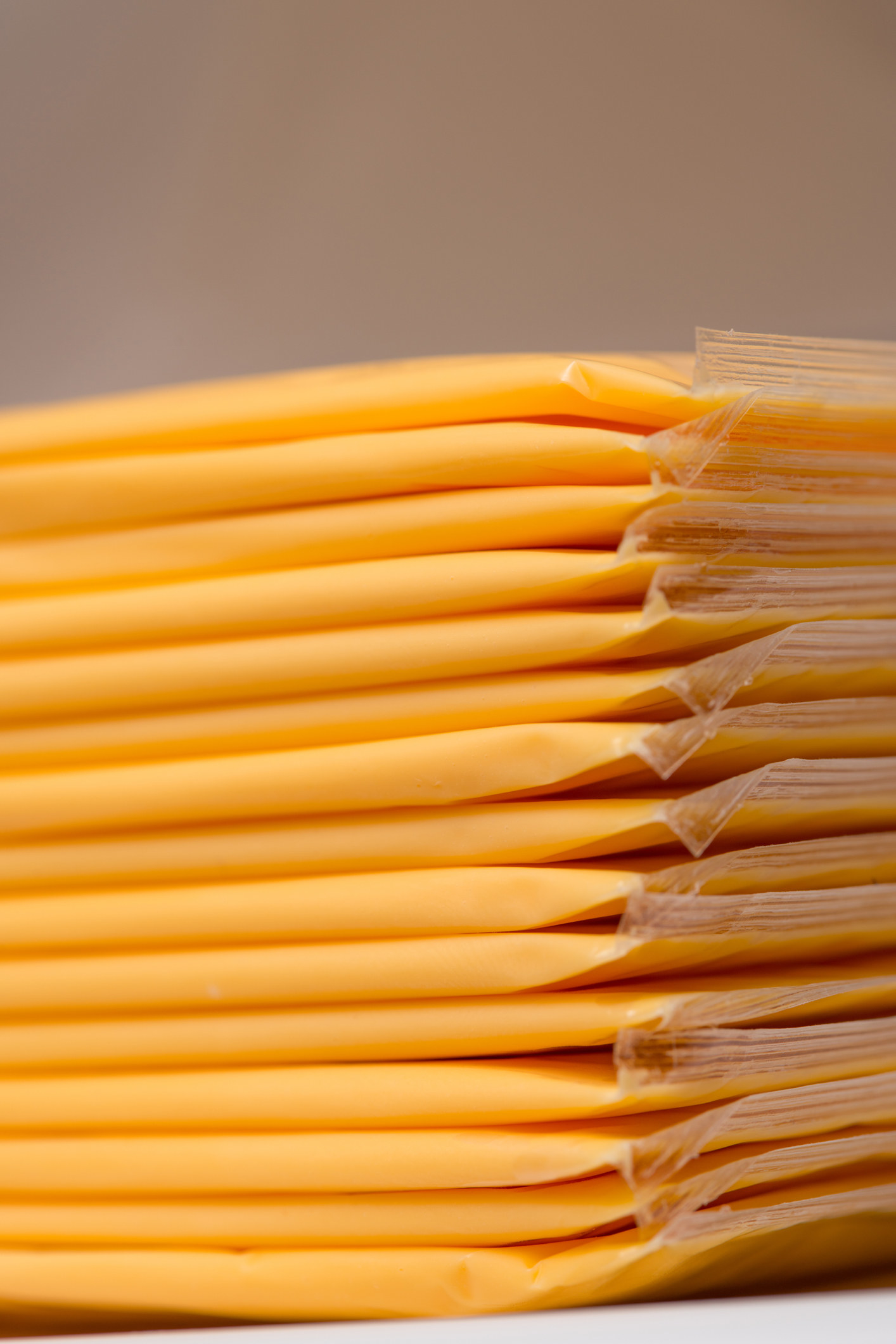 Macro closeup photo of individually packed slices of cheese