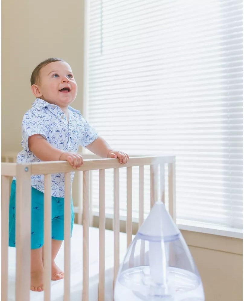Humidifier next to baby in crib