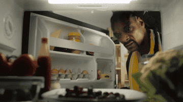 Snoop Dogg looking in the fridge