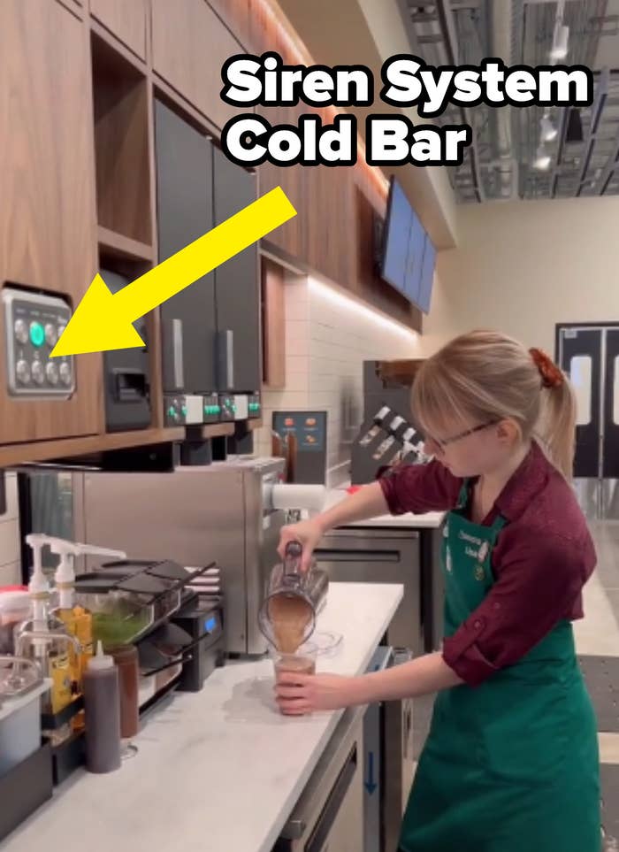starbucks barista pouring frappuccino into cup with arrow pointing to new siren system cold bar in cabinet