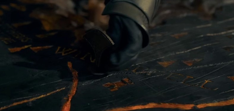 Someone places something down on the Winterfell portion of the painted table