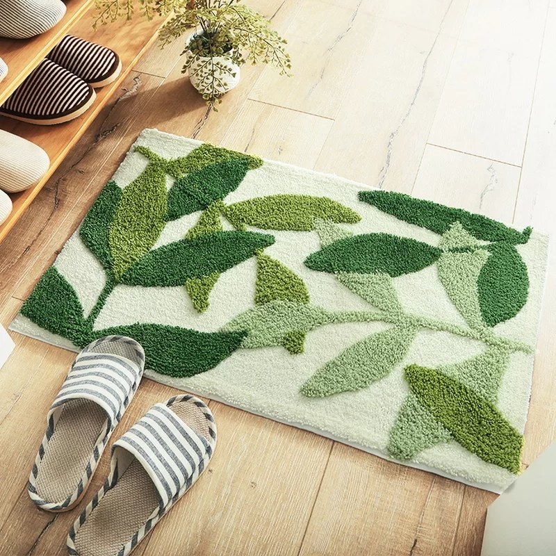A leaf-printed rectangular bathroom rug