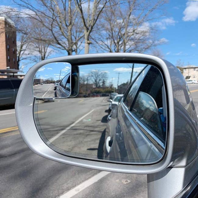 a fan-shaped blindspot mirror on a car's side mirror
