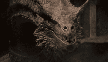 A red-scaled dragon hisses at an enemy
