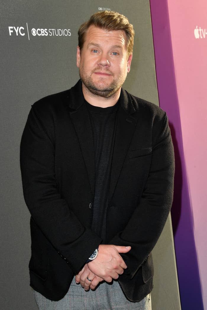 James Corden standing with his hands crossed