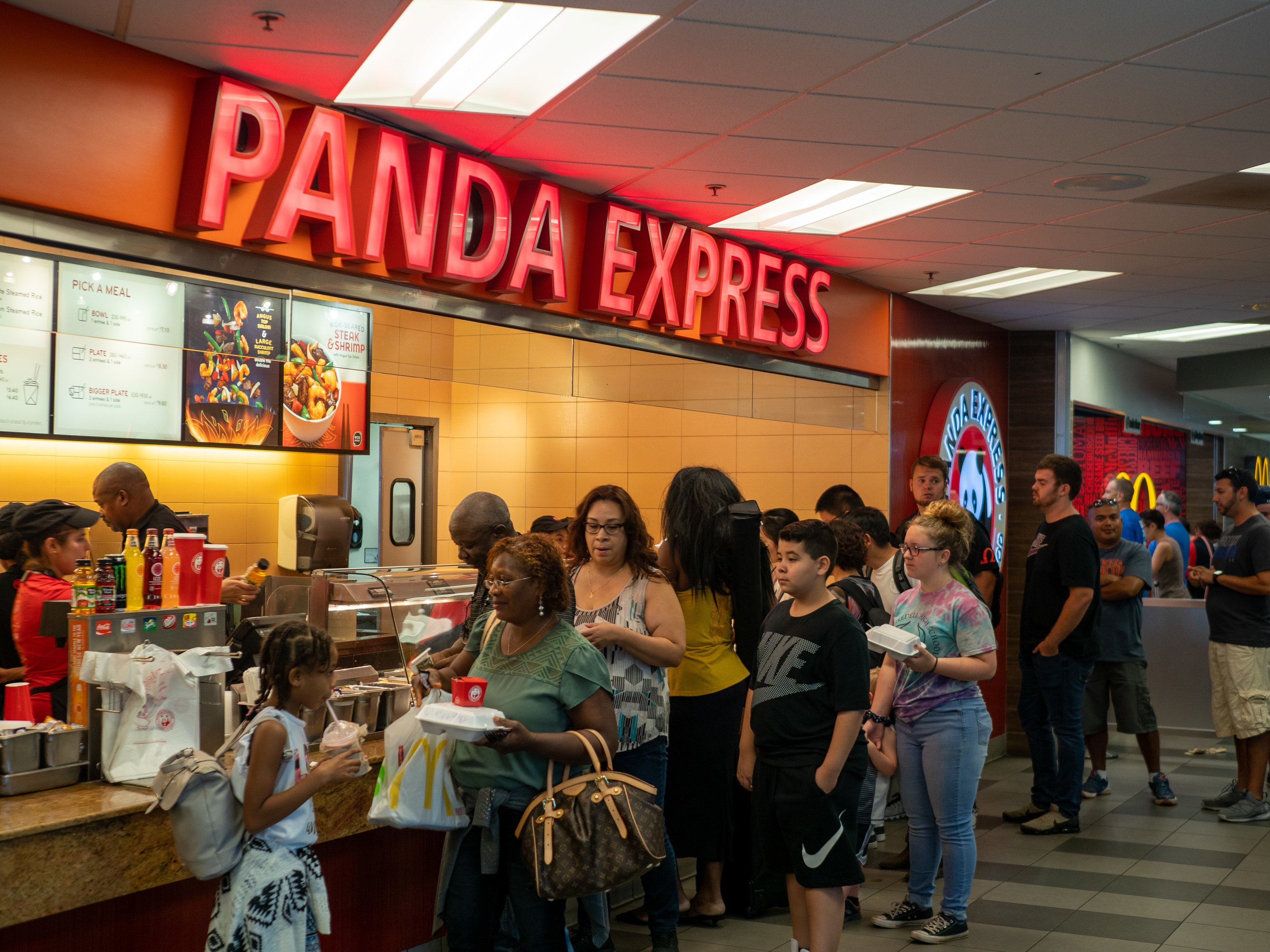 A group of people in line at Panda Express