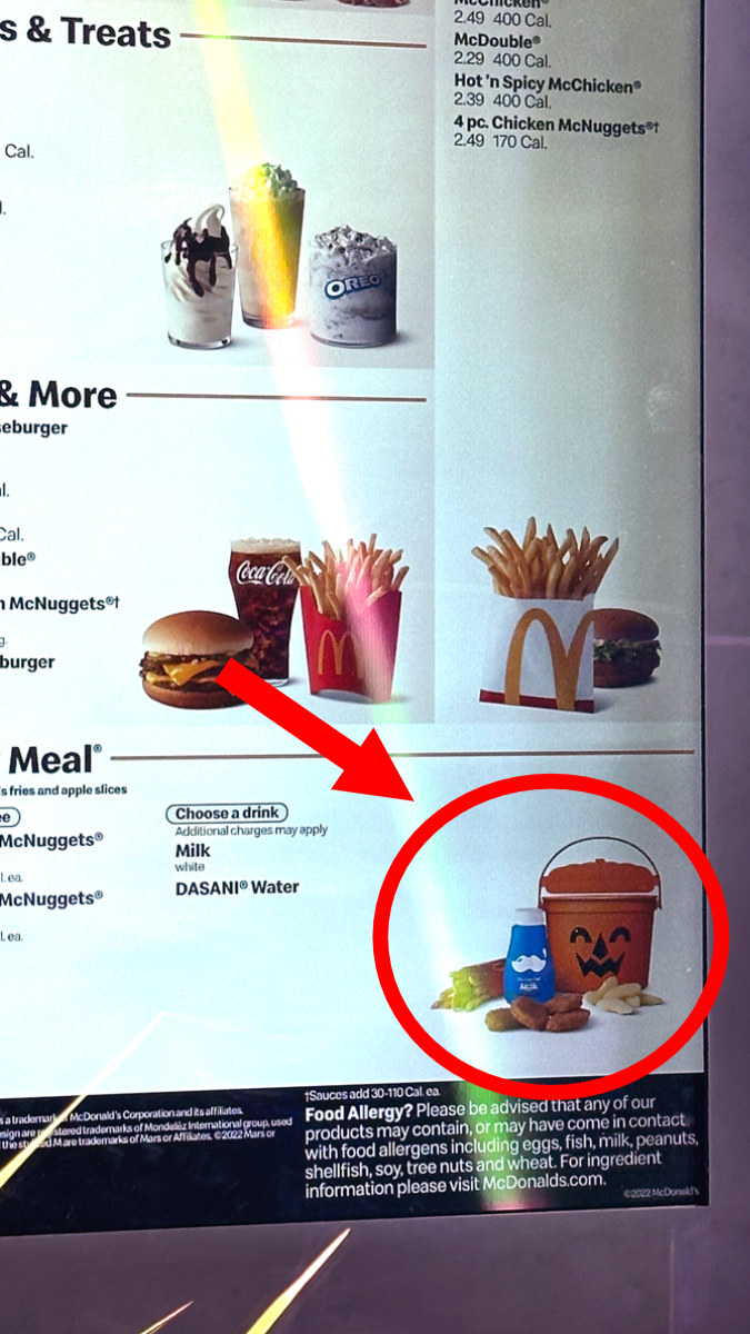 Close up of mcdonalds drive thru menu with the meal small in the bottom right corner