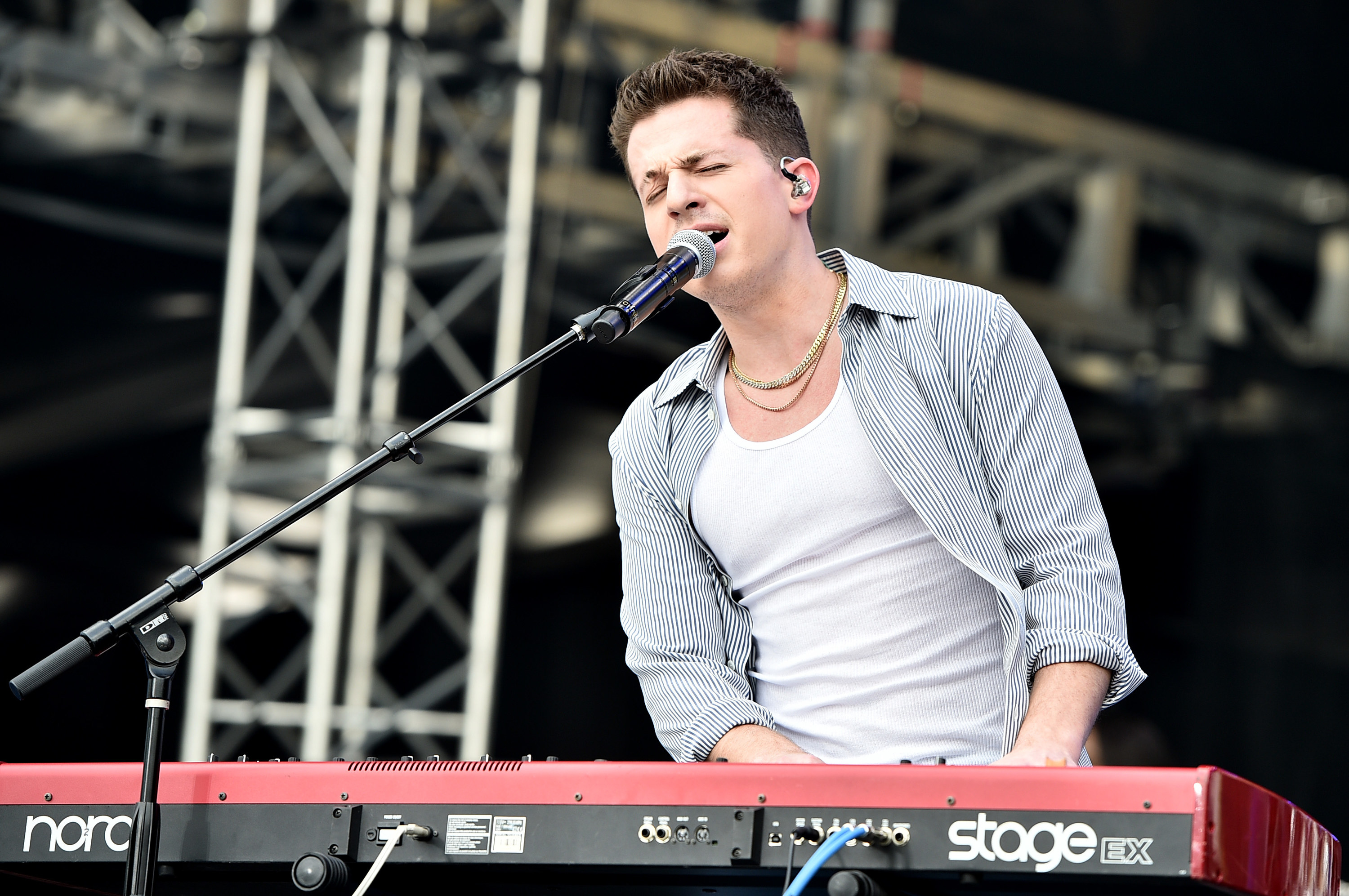 Charlie playing the keyboard and singing onstage