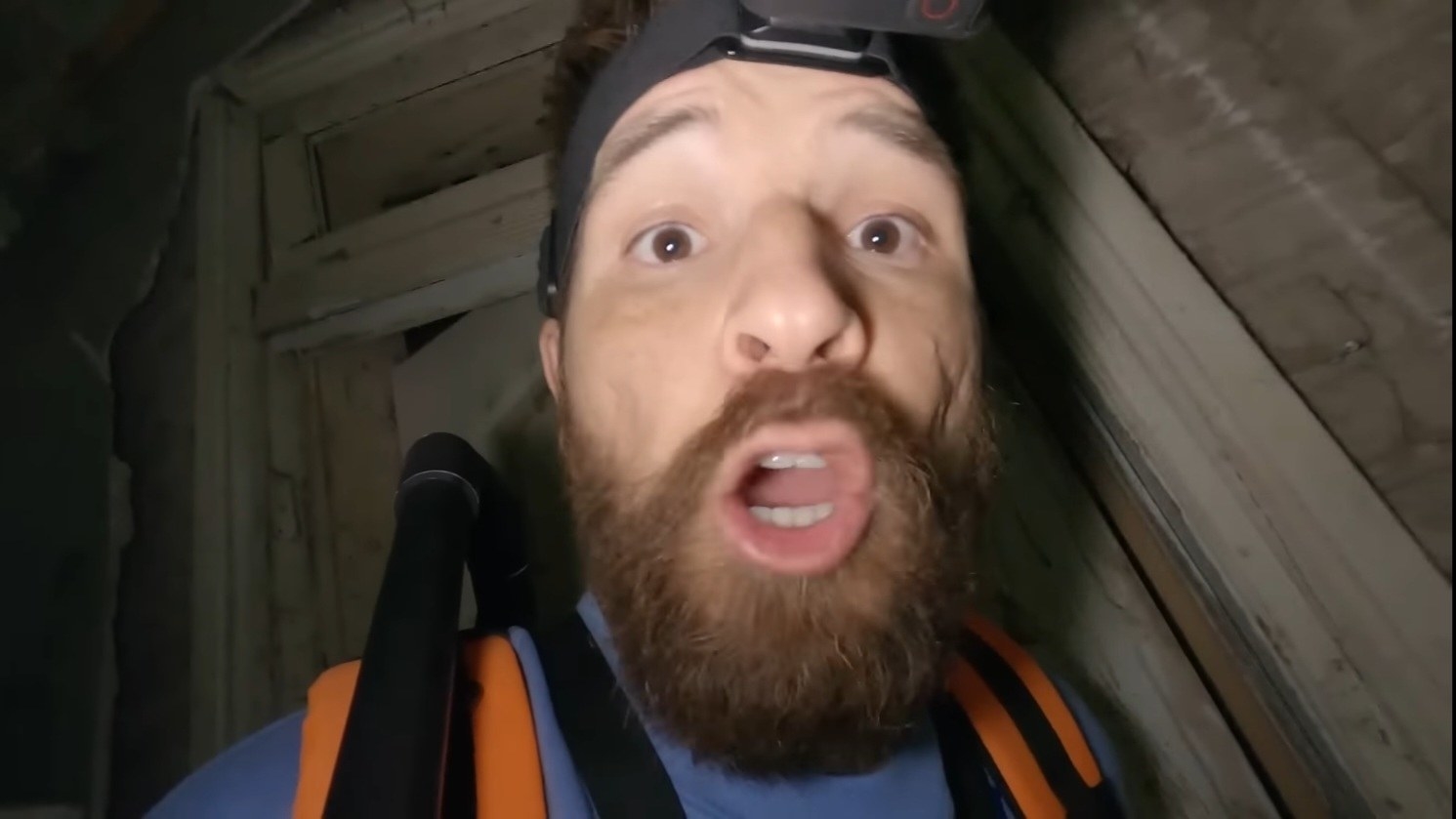 A panicked YouTuber is incredibly scared in a haunted house in “Deadstream”