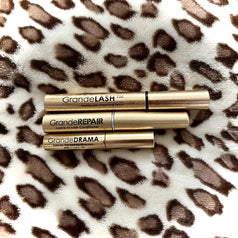the three lash products beside each other on a blanket