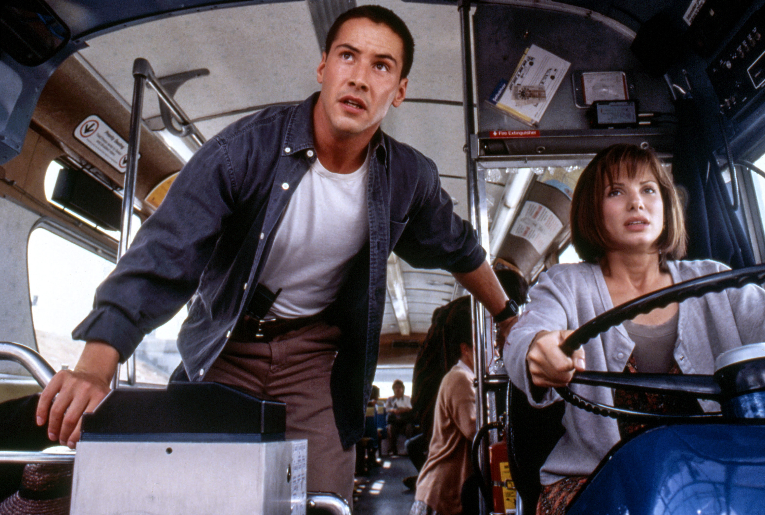 Keanu&#x27;s character looks on as Sandra&#x27;s character drives the bus