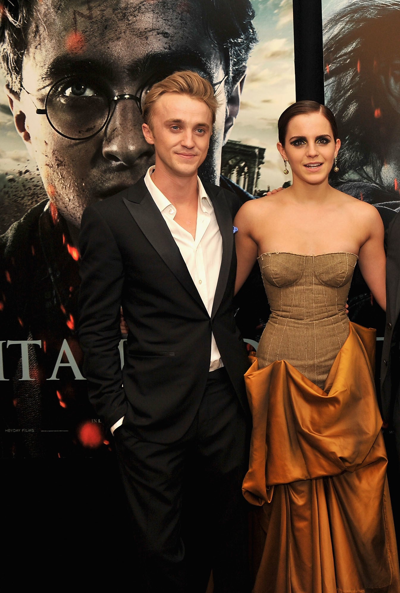 Tom and Emma pose together on the red carpet
