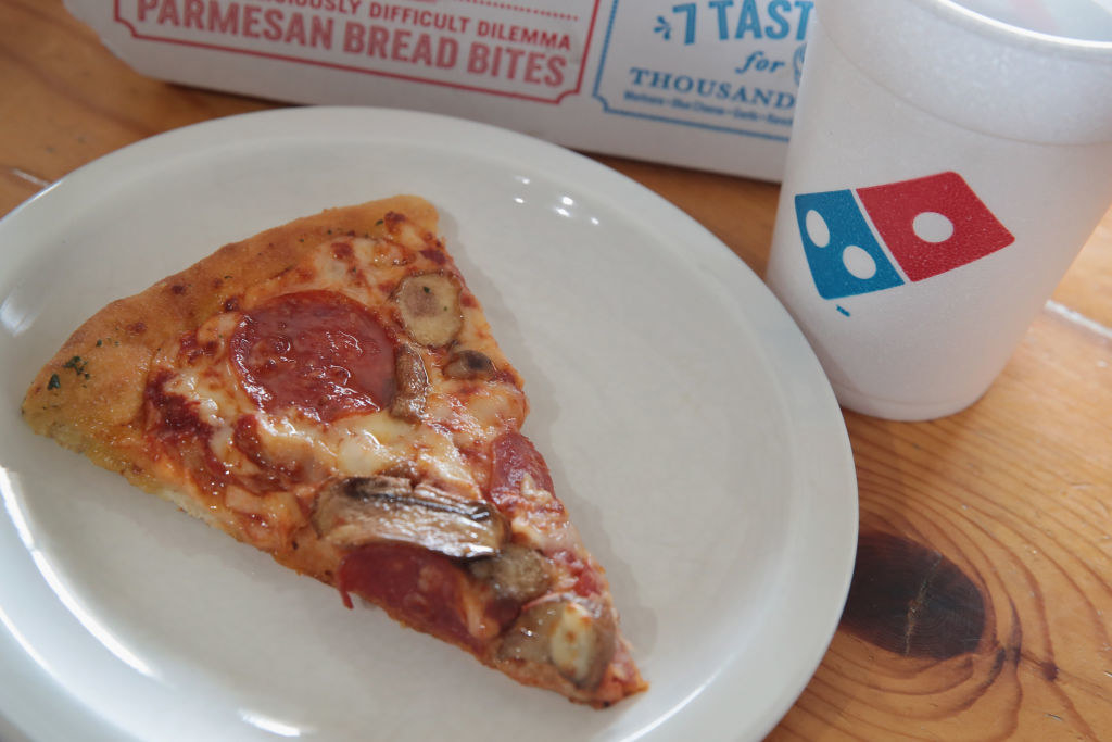 A slice of Domino&#x27;s pizza.