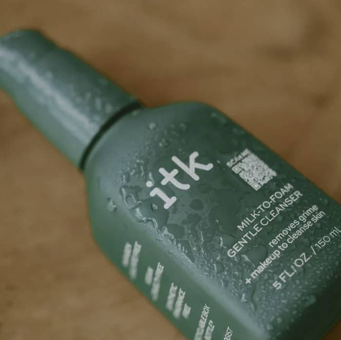 The bottle is a dark green with &quot;itk MILK-TO-FOAM GENTLE CLEANSER&quot; written on it
