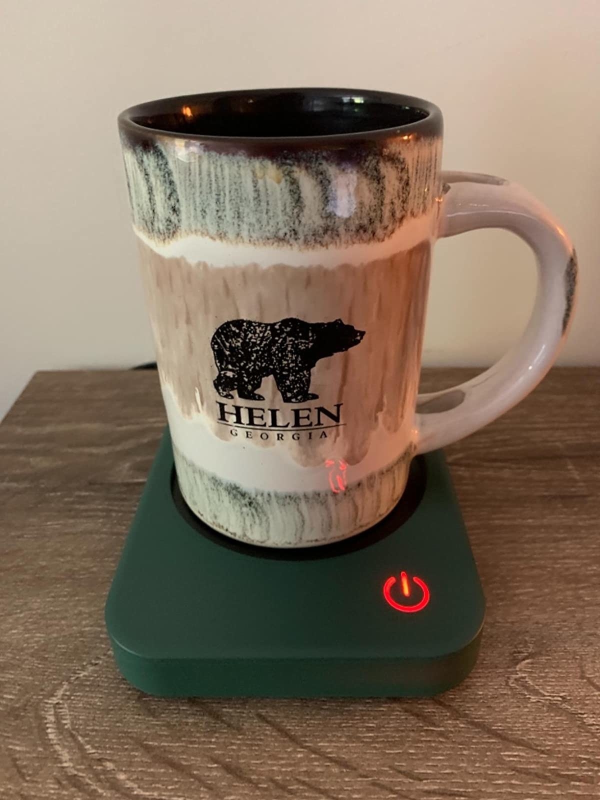 Reviewer image of mug sitting on green warmer