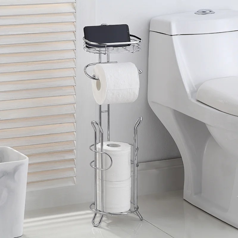 A chrome toilet paper holder with a section to hold spare rolls and a tray on top that is used for storage