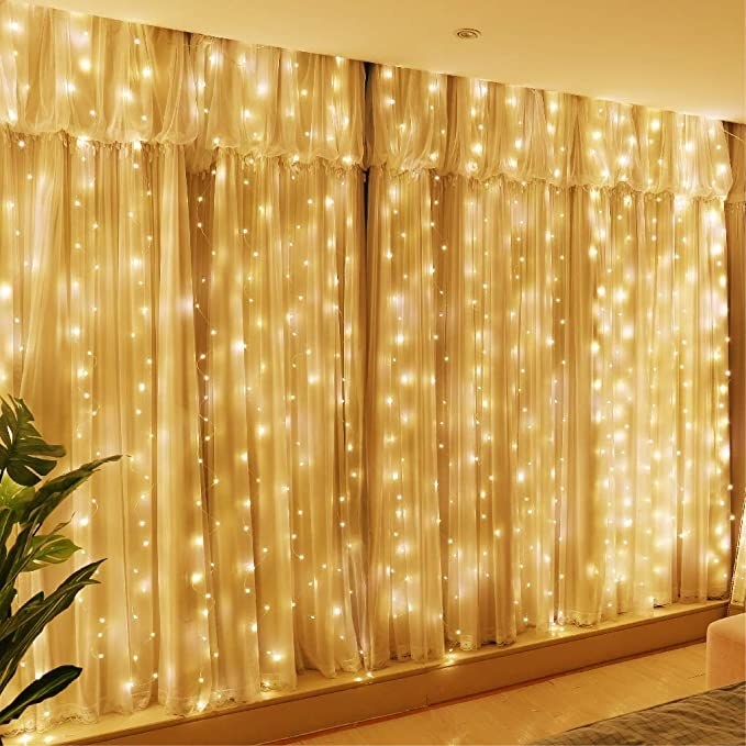 Fairy lights behind a curtain