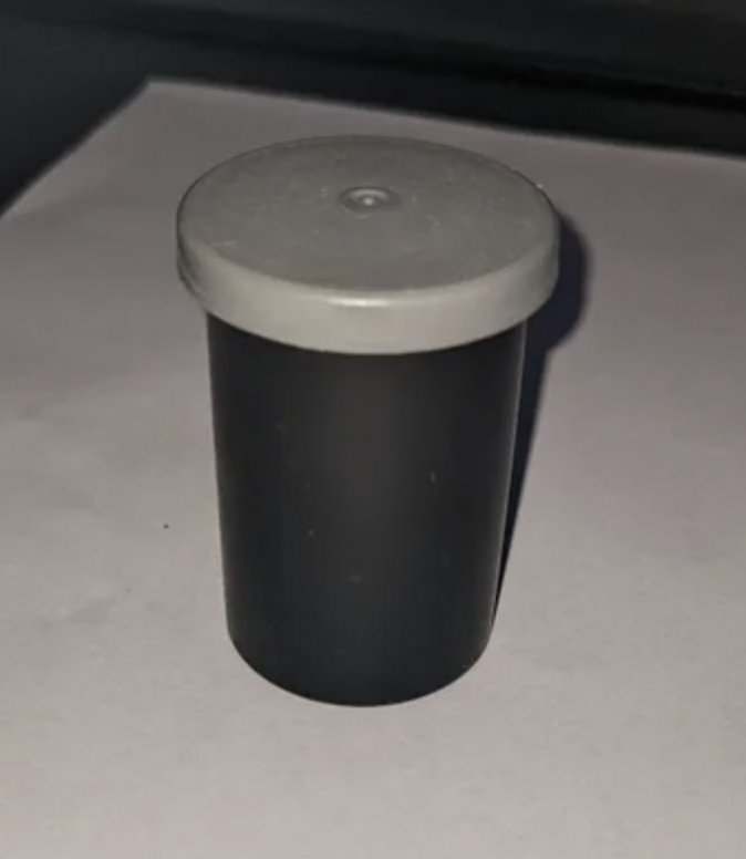 Plastic camera-film canister