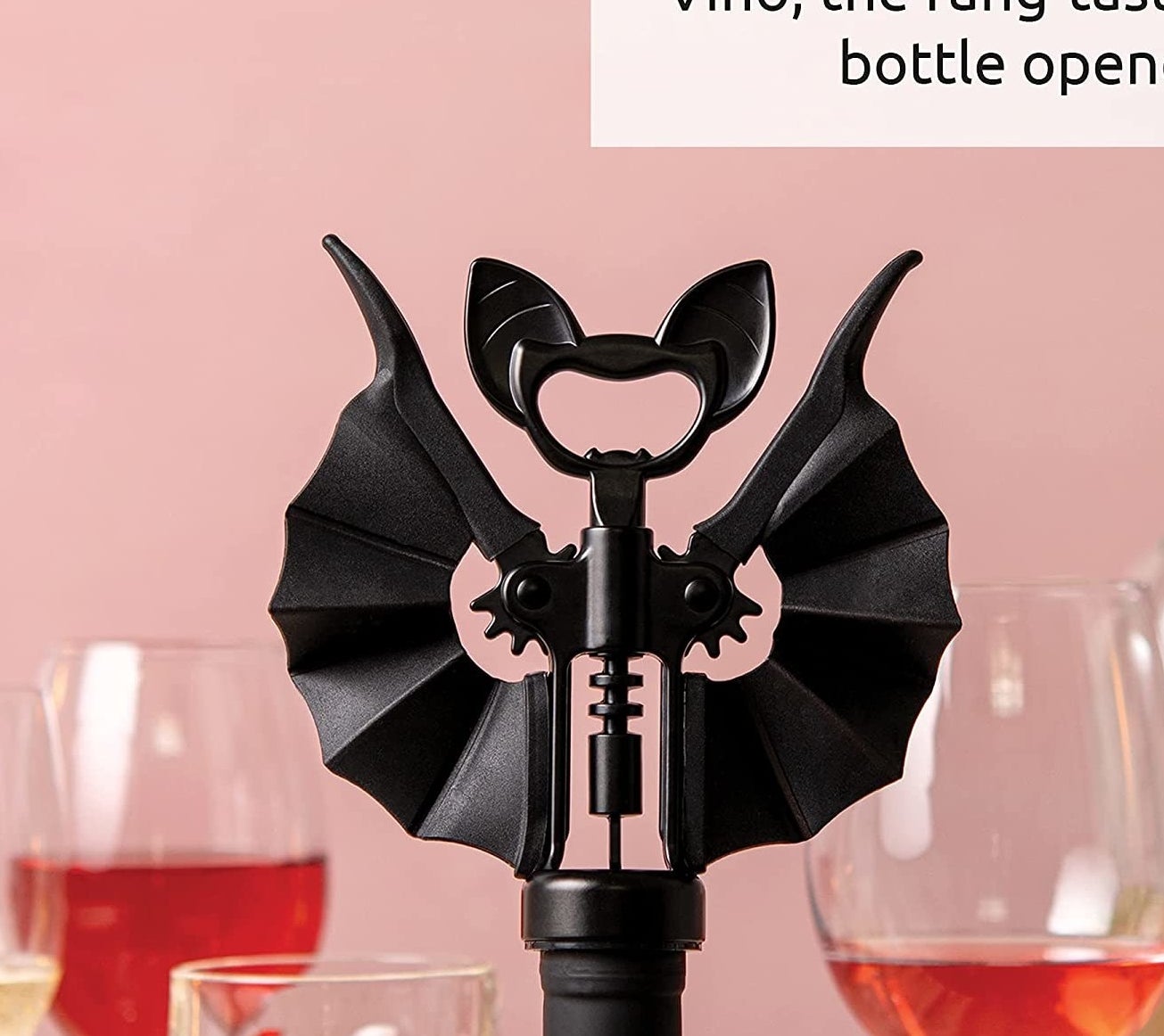a bat-shaped corkscrew inside a wine bottle