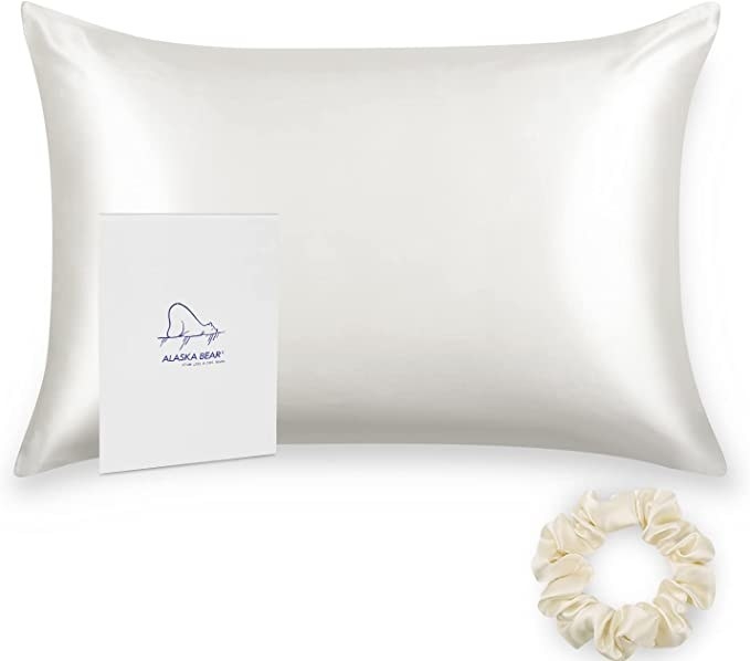 A pillow with a silk pillowcase on it