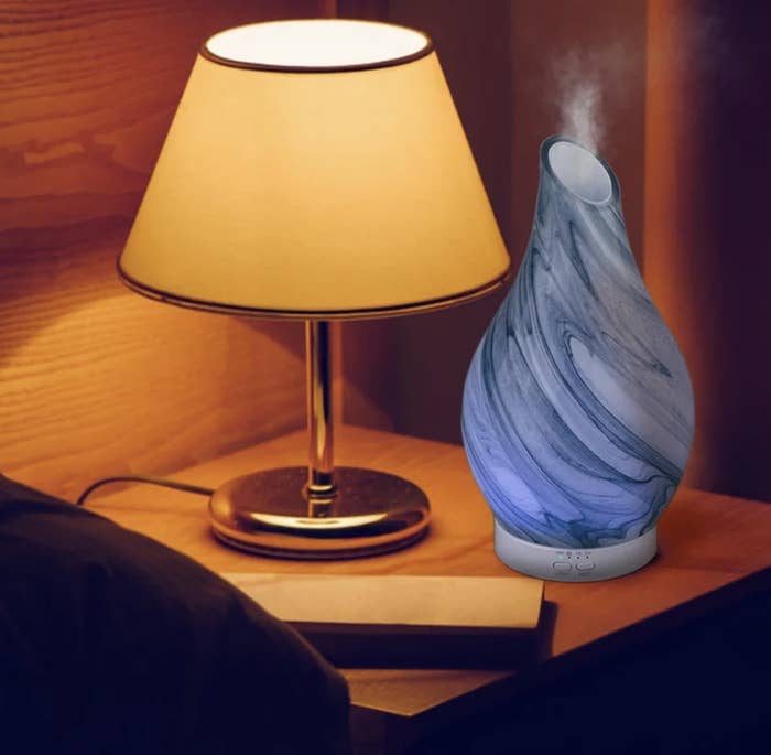The blue cone diffuser sitting on nightstand