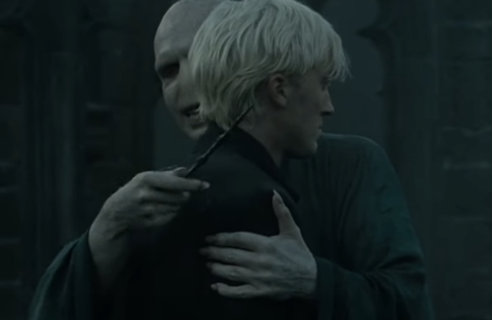 Tom Felton as Drako Malfoy, alongside Ralph Fiennes as Lord Voldemort