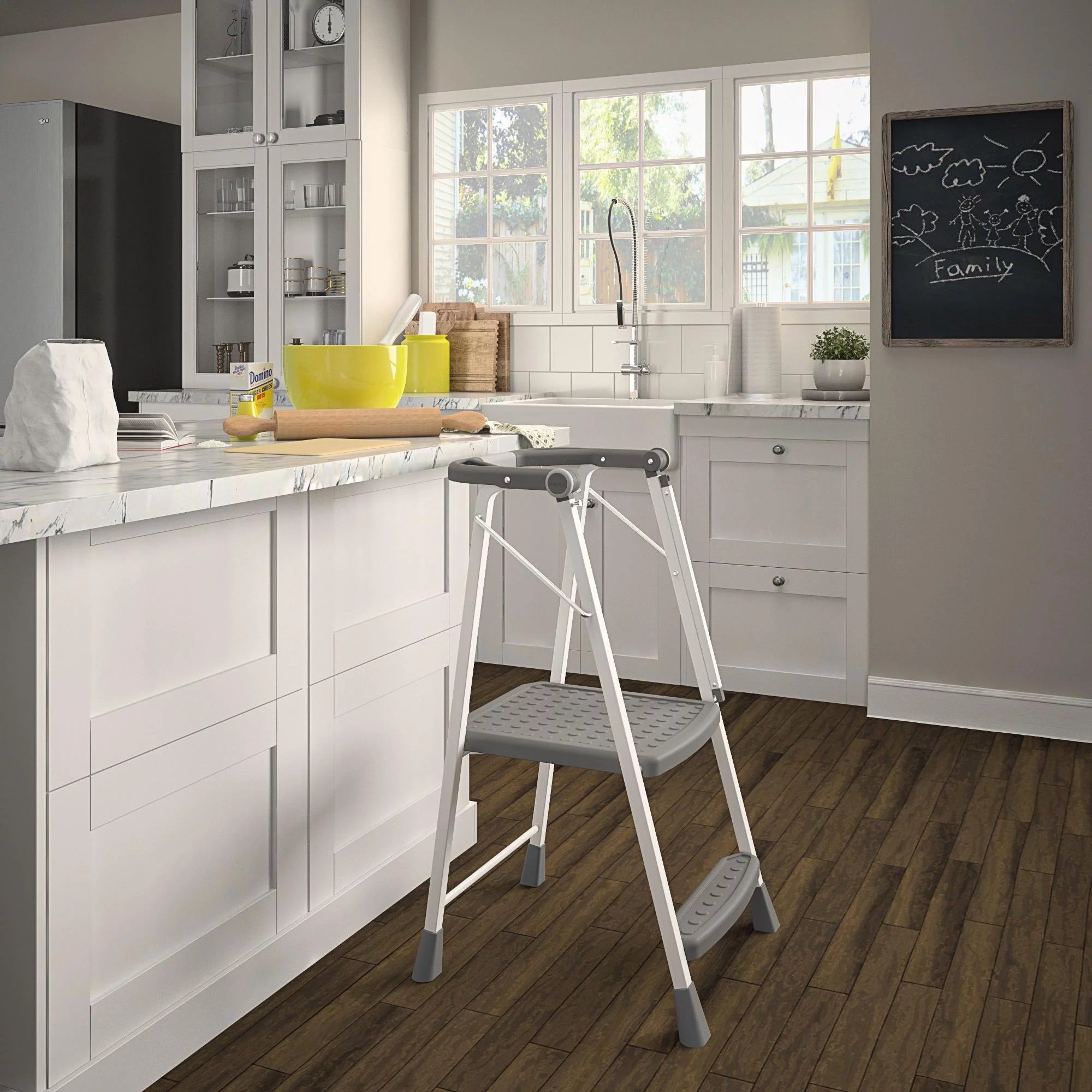 A grey and white kitchen stepper set up at a white kitchen island