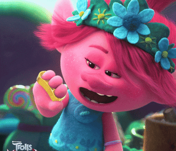 a gif of a character from trolls admiring her sparkly rings