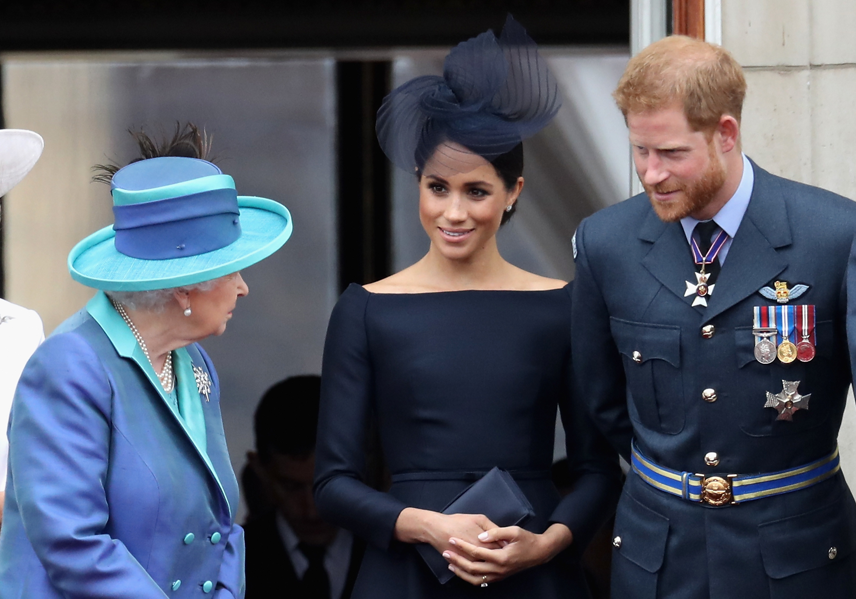 The couple speaking with Queen Elizabeth