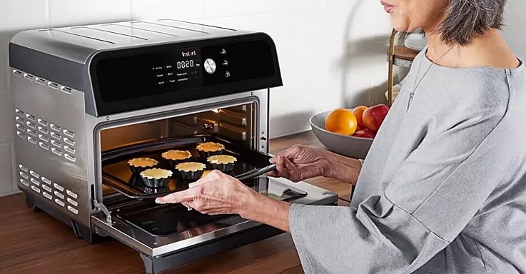 Model using the air fryer and toaster oven