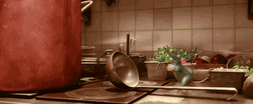 a gif of remy from ratatouille climbing a spoon into a pot
