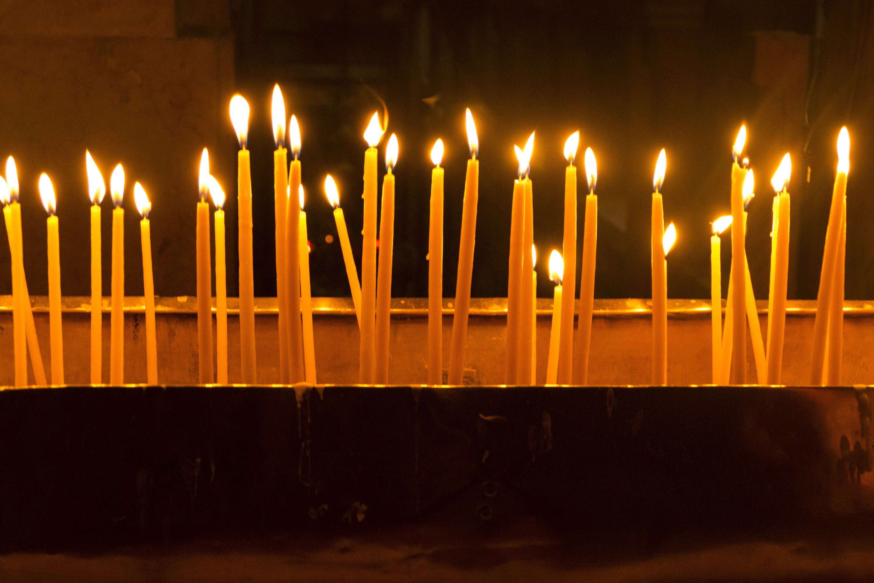 Candles for Blessings and Prayers Lite by Worshippers in The Church of The Holy Sepulchre in Old Jersusalem City in Israel a Unesco World Heritage Site