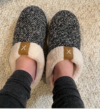 Reviewer in slip-on white and black slippers with fleece lining