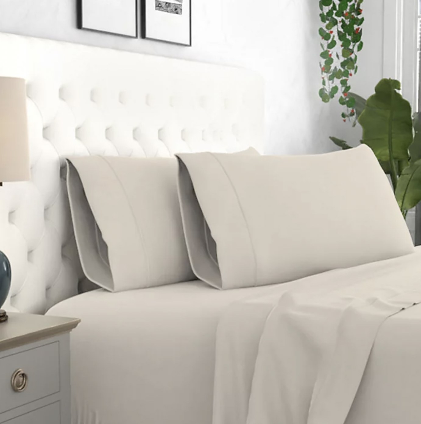 The beige pillowcases on pillows on bed