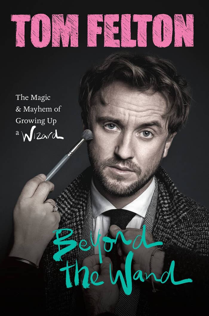 The cover of Tom&#x27;s memoir which feature a hand using a brush to touch up his makeup and another set of hands adjusting his tie