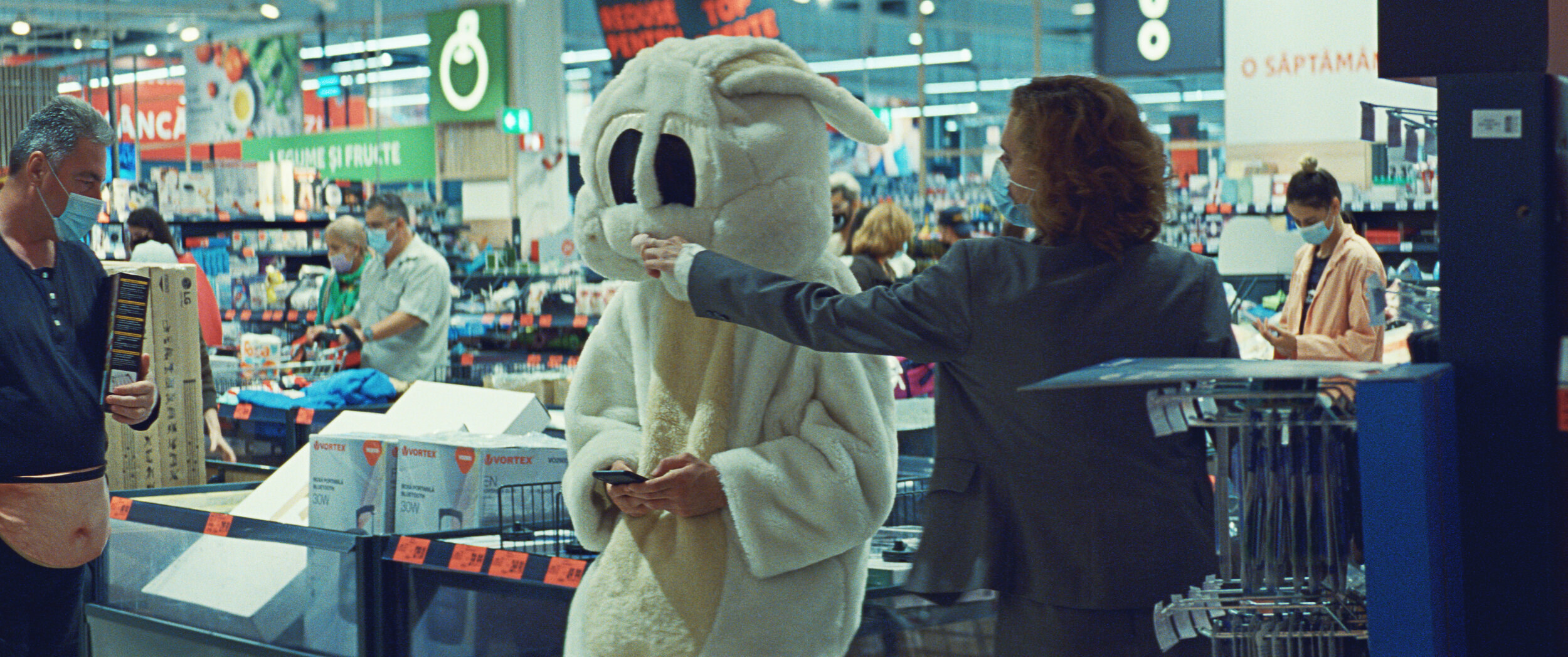 Someone in a rabbit costume at a supermarket